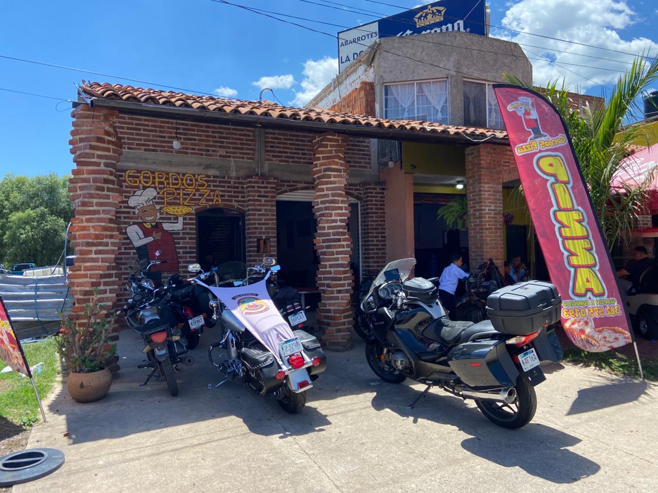 Club motorcycles parked outside Gordos Pizza